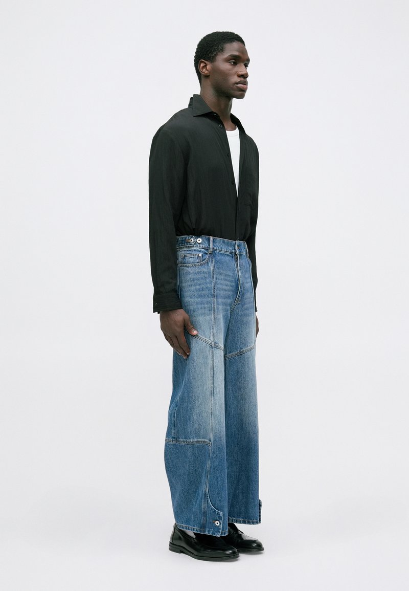 Feng Chen Wang PATCHED TROUSERS - Relaxed fit jeans - blue 