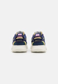 Sneakers with a navy mesh upper, beige accents, pink and green details, and a white sole. Features pull tabs at the heel for easy wear.