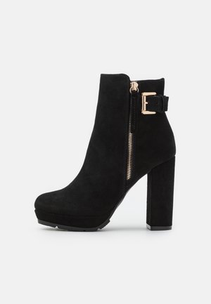 Bottines à talons hauts - black