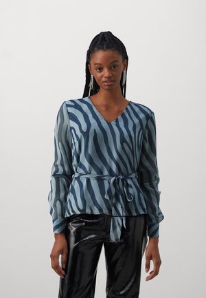 Blue and teal striped blouse with a V-neck, long sleeves, and a tied waist. The fabric has a textured, flowing appearance.