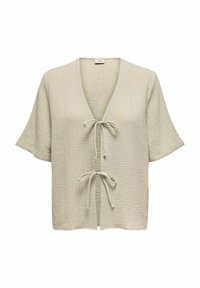 Lys grøn, struktureret bluse med korte ærmer, V-hals og knyt-front lukning. Har et krøllet stofmønster over det hele.