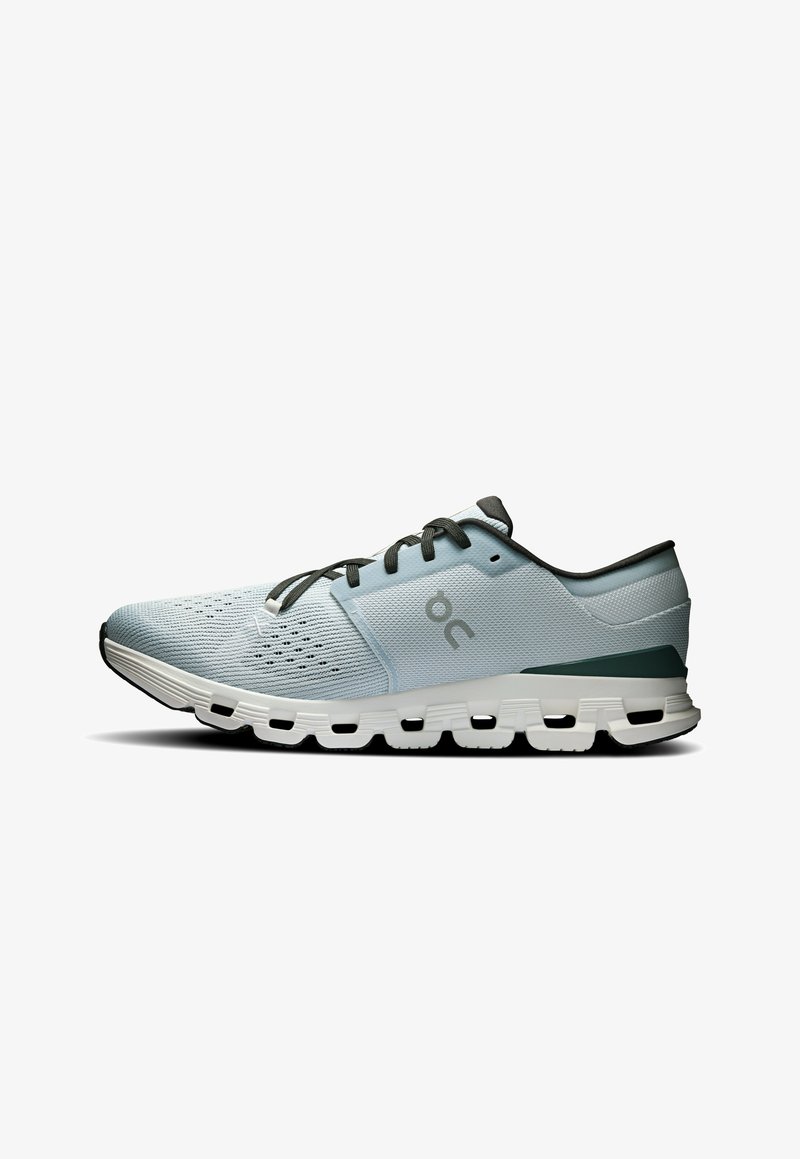 Light blue athletic shoe with mesh upper, dark green accents, and a white sole featuring distinct cushioned pods for support.