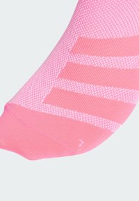Pink athletic sock featuring a textured knit pattern with horizontal stripes, a reinforced toe, and smooth fabric finish.