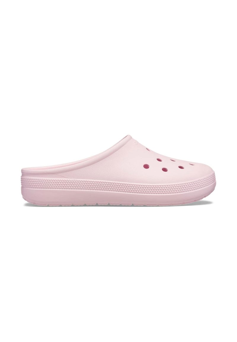 Pink clogs made of rubber, featuring a smooth surface, rounded shape, and ventilation holes on the upper. Textured sole for grip.