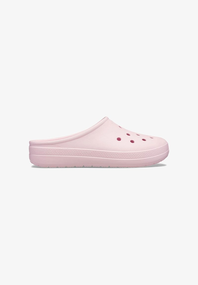 Pink clogs made of rubber, featuring a smooth surface, rounded shape, and ventilation holes on the upper. Textured sole for grip.