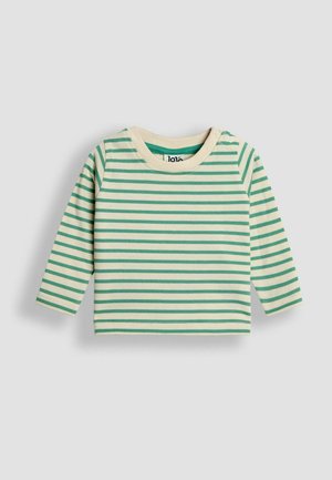 Ilgiem piedurknēm kreklam krēmkrāsā ar zaļām horizontālām svītrām. Tam ir apaļa izgriezne un divi spiedpogu slēdži uz viena pleca. Mīksts kokvilnas materiāls.