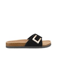 Black suede slide sandal with a cork footbed, featuring a metallic buckle accent on the strap. Flat, lightweight, and textured sole.