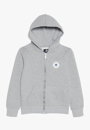 Grauer Hoodie mit Reißverschluss aus Baumwollmischgewebe. Verfügt über ein Logo-Patch, Fronttaschen und eine Kapuze mit Kordelzug. Weiche Textur durchgehend.