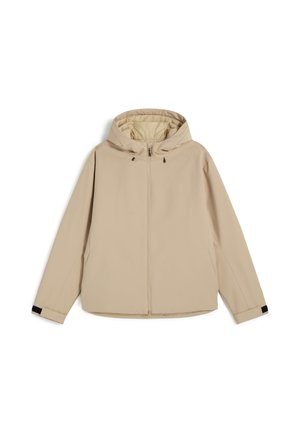 Beige capuchonjack met voorrits, lange mouwen, verstelbare manchetten en trekkoordjes aan de capuchon, getoond tegen een witte achtergrond.
