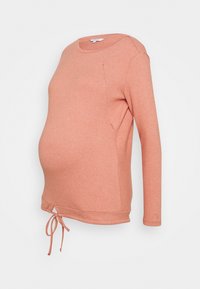 Těhotenská mikina z měkké korálové látky, s dlouhými rukávy, kulatým výstřihem, bočním dílem s rozparkem a nastavitelným stahováním na lemu.