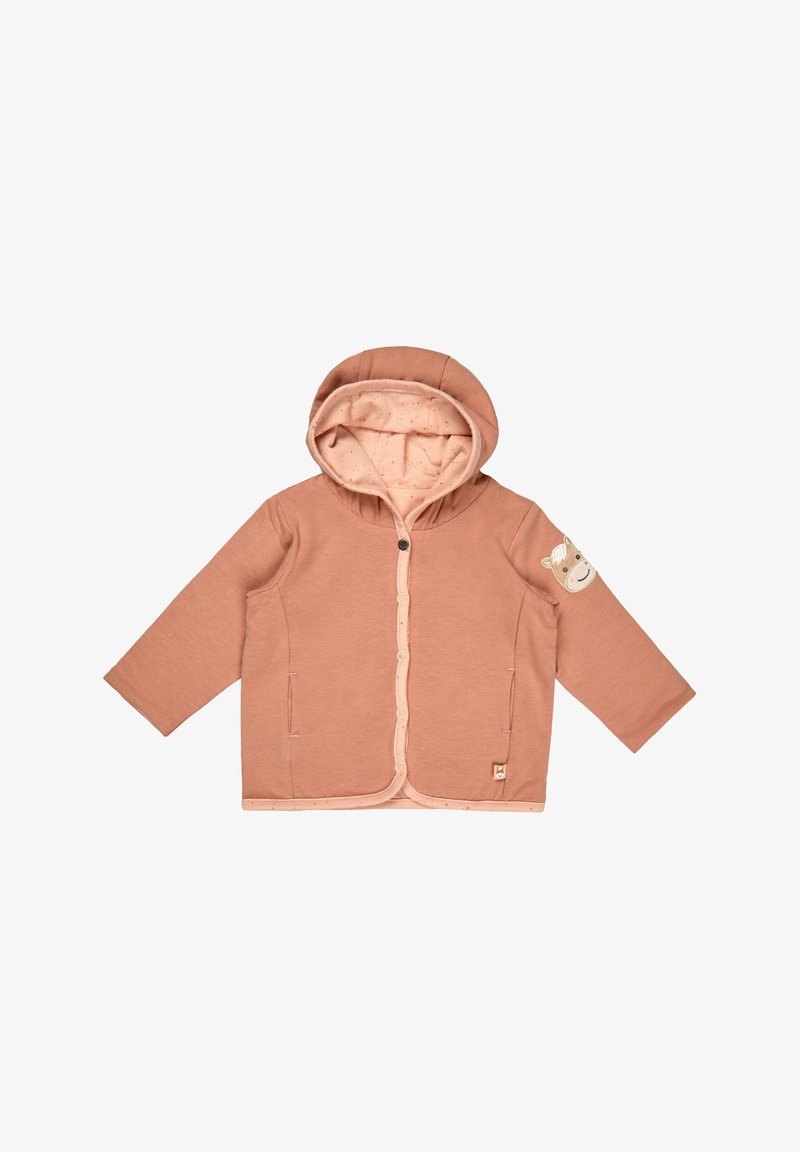 Pale pink hoodie with a lined hood, front pockets, snap fastenings, and a bear patch on the sleeve. Soft fabric, relaxed fit.