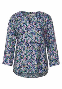 Kukkalöysä pusero tummansinisellä taustalla, jossa on eloisa sekoitus vaaleanpunaisia, vihreitä ja keltaisia kukkia. Napillinen etuosa ja 3/4-hihat.