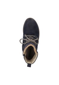 Bottines chelsea en cuir texturé bleu marine, dotées d'une doublure en fourrure synthétique beige, d'un laçage et d'une semelle robuste.