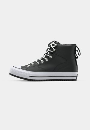 High-top black sneakers made of smooth leather with white rubber sole, silver eyelets, and white laces. Features a textured toe cap and heel tags.