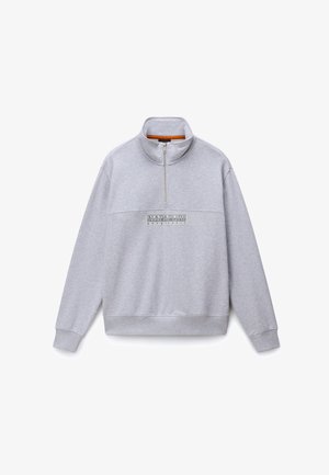 Siva jopa z vloženim žepom in polovičnim zadrgo, z logotipom na prsih, rebrastimi manšetami in sproščenim krojem. Gladek material iz bombažne mešanice.