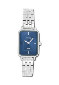 Montre rectangulaire argentée avec un cadran bleu, présentant des index horaires argentés et un bracelet en acier inoxydable. Le nom de la marque "OOZOO" est visible.