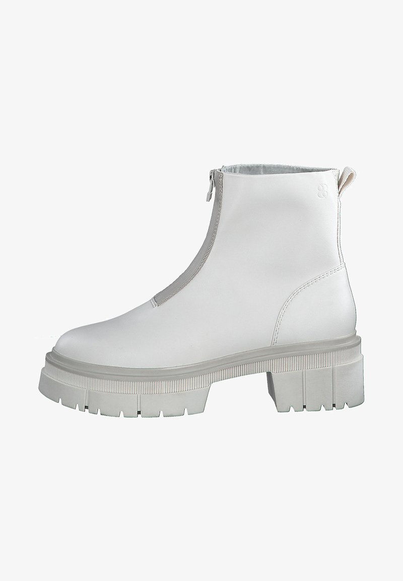 White leather ankle boots with a zip closure, chunky grey outsole, textured side details, and smooth upper surface.