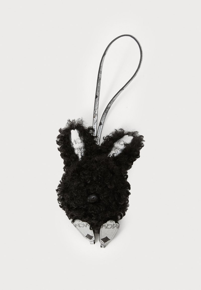 Accesoriu burete negru sub formă de iepure, cu textură creț, urechi interioare albe, ochi și accesorii de argint; dispune de o buclă pentru atașare.