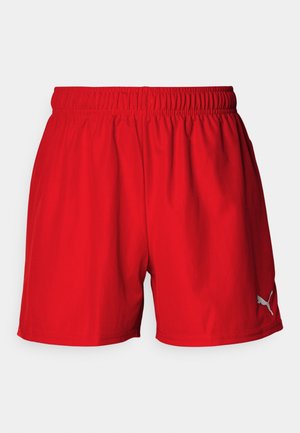 Calções atléticos vermelhos feitos de um tecido leve e suave. Cintura elástica e um pequeno logótipo branco no canto inferior esquerdo.