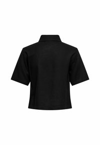 Polo noir à manches courtes avec un col classique, vu de dos sur un fond blanc.