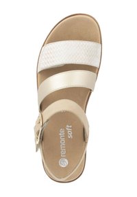 Beige sandal with three straps, one featuring a woven texture. Soft insole and adjustable buckle. Designed for comfort and casual wear.