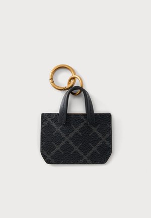Black textured mini handbag keychain with two black handles attached to two interlinked gold rings on a white background.