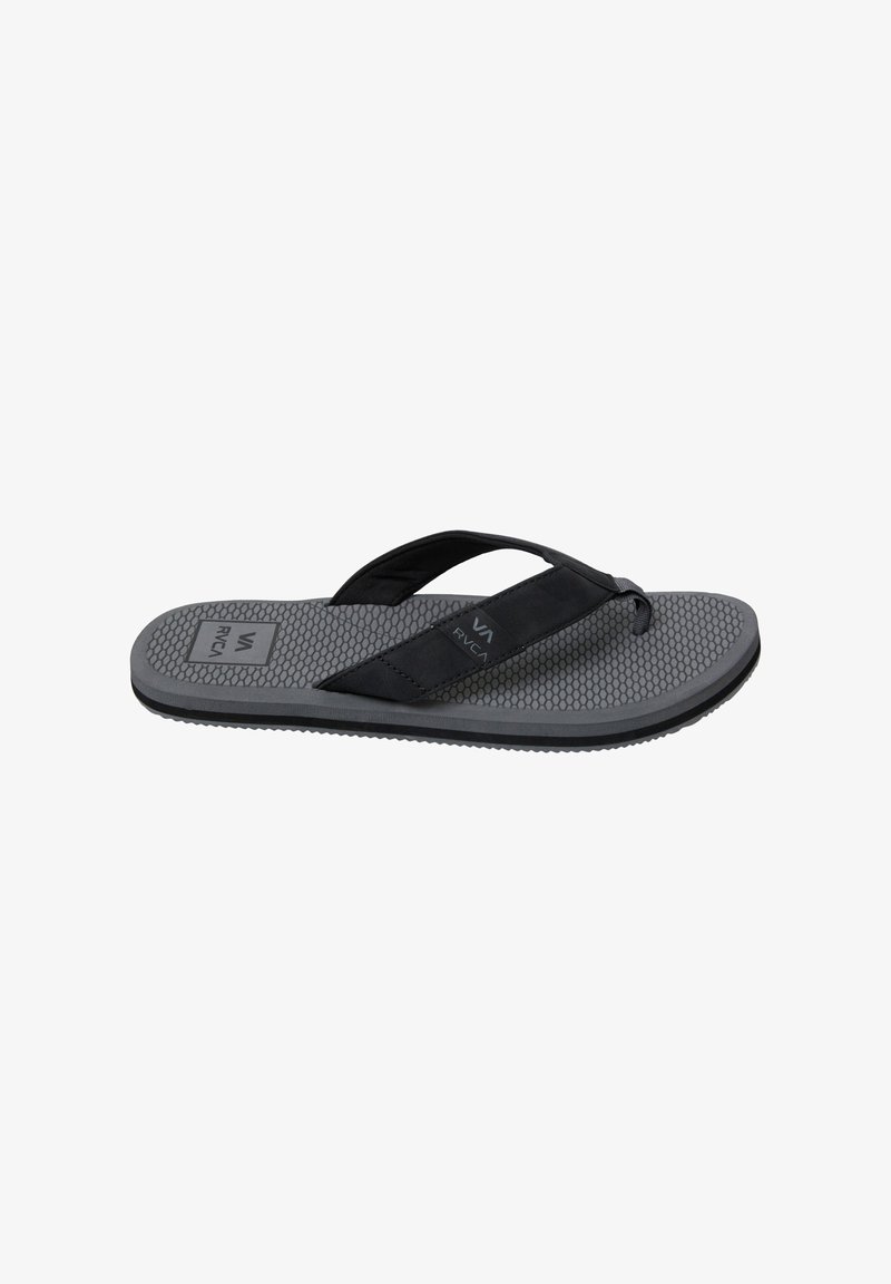 Black flip-flop sandal with a textured gray sole, characterized by a wide strap and lightweight design, featuring a honeycomb pattern.