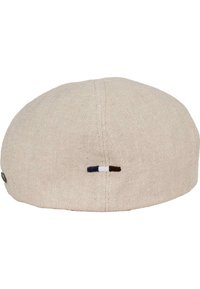 Beige linnen pet met een ronde vorm, voorzien van een kleine geborduurde accenten in bruin, blauw en wit aan de achterkant. Hoge mate van gladheid.