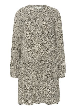 Dolga obleka z dolgimi rokavi v črno-belem cvetličnem vzorcu, z okroglim ovratnikom in sproščenim krojem. Narejena iz lahkega teksturiranega blaga.