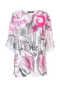 Lockere Bluse mit kurzen Ärmeln in Weiß mit pinkem und schwarzem Graffiti-Print. Mit V-Ausschnitt und umgeschlagenen Ärmeln, die eine subtile Textur aufweisen.