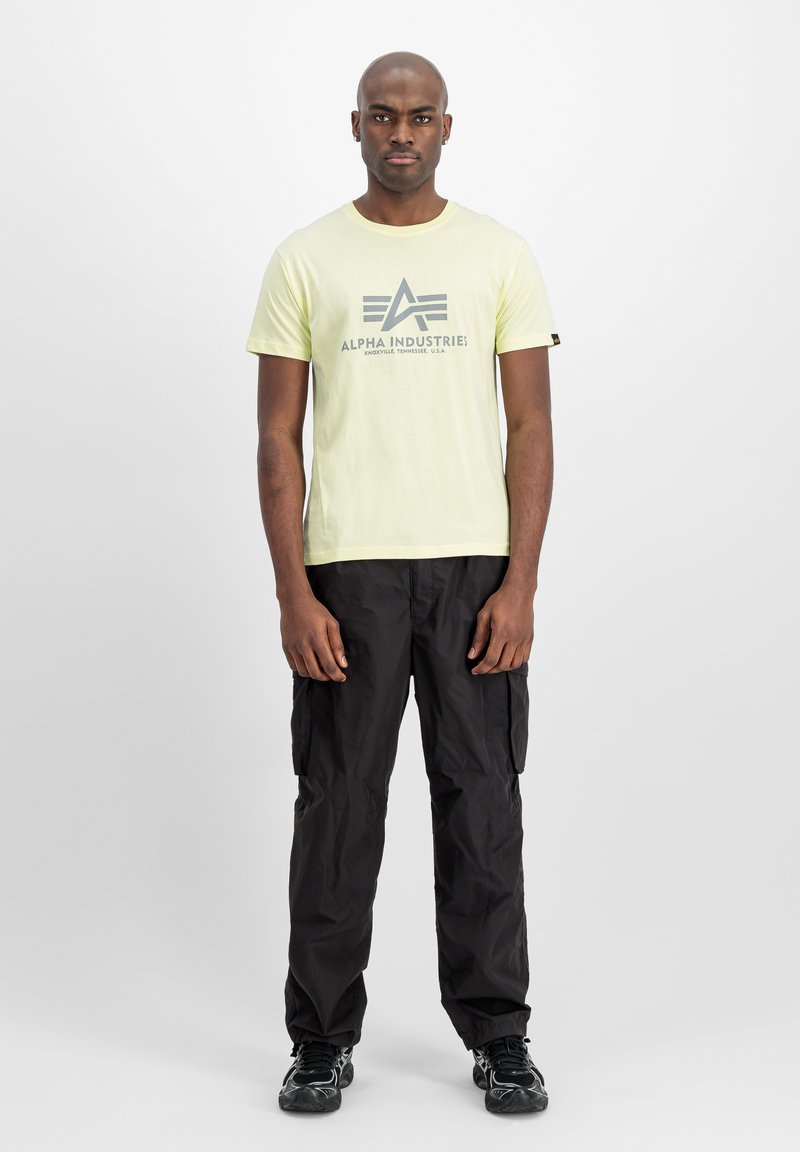 Alpha Industries Triko s potiskem - retro yellow