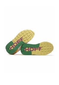 Sport shoes with rubber sole featuring a yellow base, green accents, and purple branding. Textured pattern for traction and support.