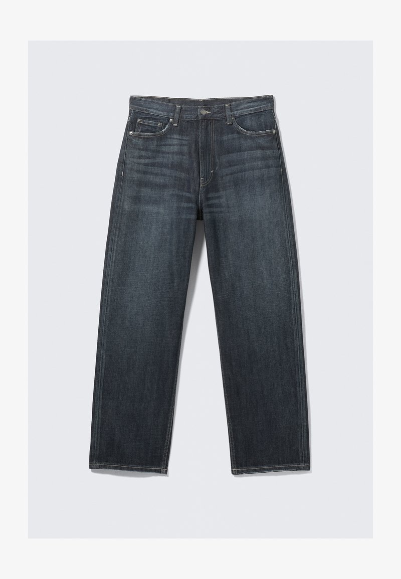 Tumši zili taisnas kājas džinsi no džinsa. Ir piecas kabatas, rāvējslēdzēja aizdare un redzamas šuves gar šuvēm.