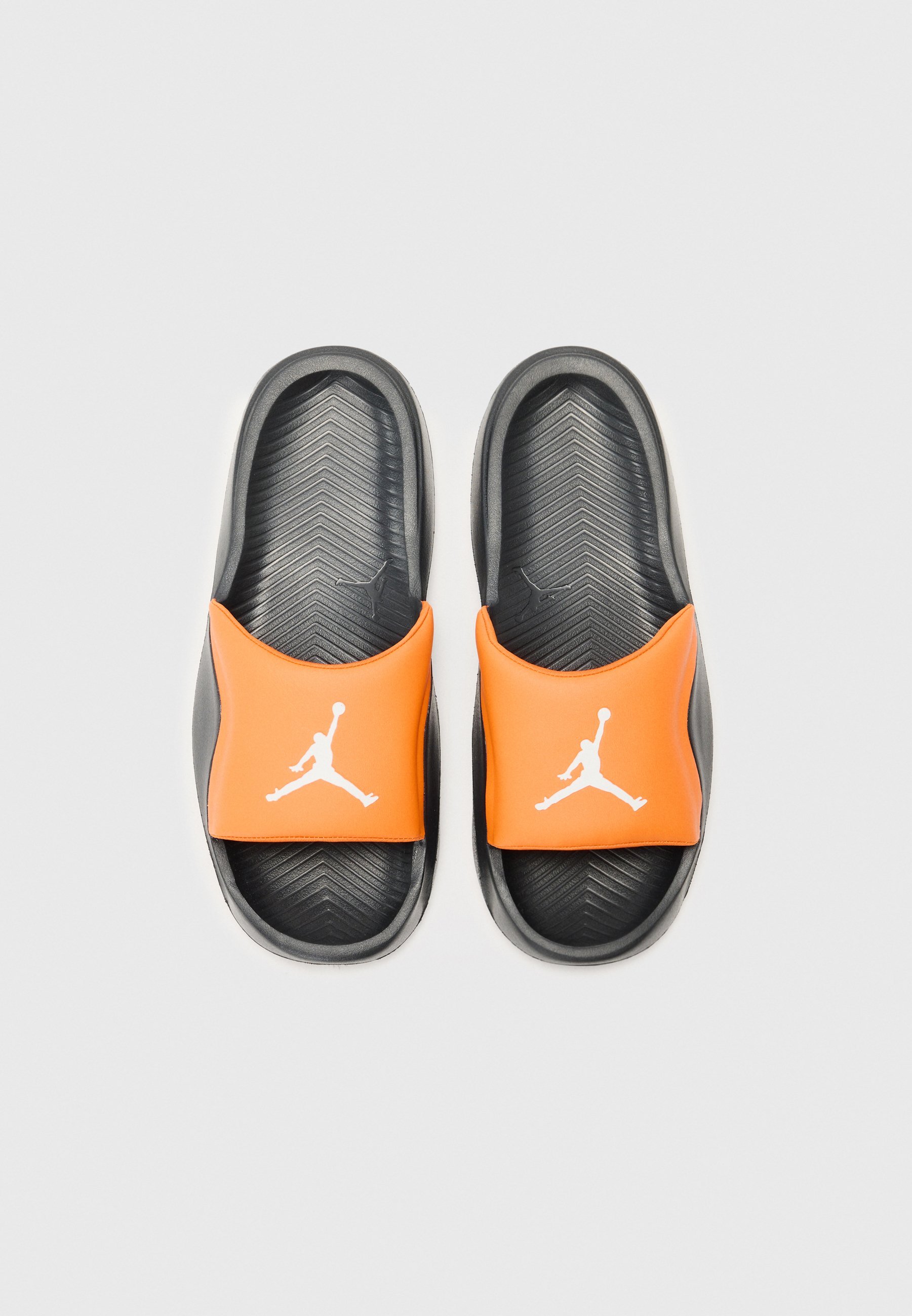 white and black jordan sandals