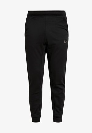 Pantalon de sport noir à coupe ajustée, avec une taille élastique, des poches latérales et un petit logo Nike gris sur la jambe gauche. Tissu en polyester lisse.
