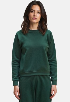 Dunkelgrüner Sweatshirt mit Rundhalsausschnitt und Rippbündchen, das eine glatte Textur und eine lockere Passform aufweist, kombiniert mit passenden Hosen.