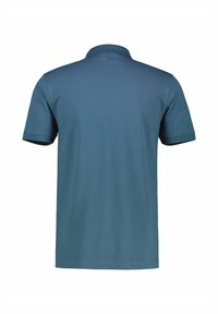 Polo shirt in deep blue, short sleeves, textured fabric, classic collar, solid color, no visible logos or patterns on the back.
