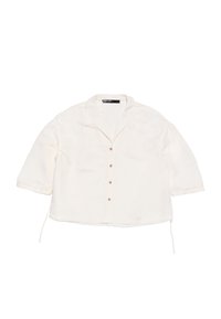 White button-up shirt with short sleeves, soft texture, collar, and five buttons down the front, featuring drawstrings at the hem.
