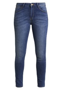 Jeans ajustados de denim; azul oscuro con un desvanecimiento más claro. Presenta bolsillos frontales, un botón de metal y acentos de costura a lo largo de las costuras.