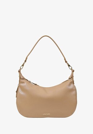 Bolso de cuero beige con forma curva, correa única y detalle de cremallera exterior. Presenta el logo de la marca en dorado en la parte frontal.