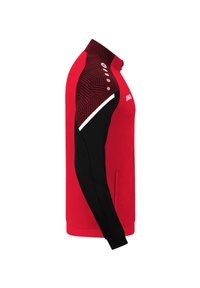 Red and black long-sleeve sports jacket with patterned shoulder panels and a high collar, featuring a small JAKO logo on the chest.