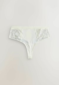 Fehér tanga alsónemű sima elülső résszel, finom csipke oldalpanelekből. Puha anyag, alacsony derékú kialakítással.