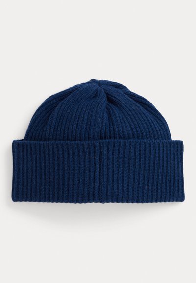 Gorro de punto azul marino con textura acanalada y borde doblado. Presenta una parte superior redondeada con costuras verticales. Fabricado en material suave.
