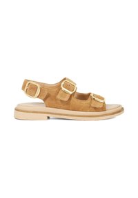 Tan suede sandal with two wide straps, gold buckles, open toe, and low profile beige sole. Casual and breathable design.