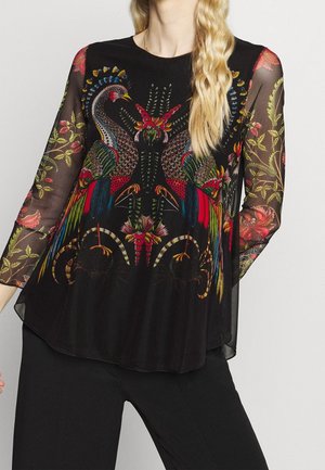 Schwarzes, durchsichtiges Oberteil mit bunten, gestickten Pfauen und floralen Mustern. Lange Ärmel, lockere Passform und abgerundeter Saum.