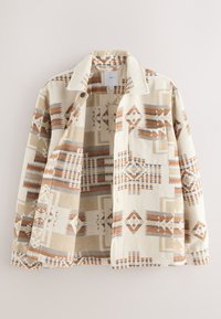 Veste boutonnée avec un motif géométrique beige, crème et marron. Tissu doux, col et détail de poche avant. Ouverte, montrant le design intérieur.