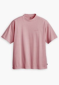 Světle růžové tričko s krátkým rukávem vyrobené z měkké bavlny. Disponuje kulatým výstřihem a jemným tonálním logem "Levi's" na hrudi.