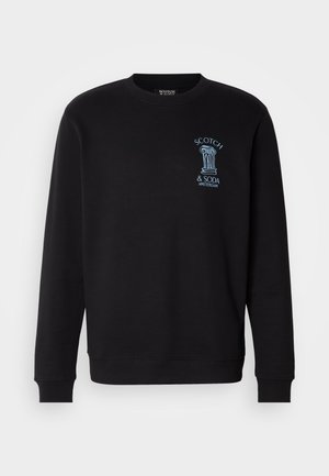 Sweat-shirt noir à manches longues, avec des poignets côtelés et un col rond. Présente un logo graphique bleu sur la poitrine avec des éléments décoratifs.