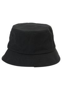 Chapeau seau noir en coton, avec un sommet rond, un large rebord inclin&eacute; vers le bas, et des accents cousus le long du bord.