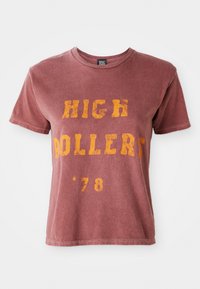 Maroon short-sleeve t-shirt with a crew neck, featuring yellow distressed text reading "HIGH ROLLERS '78" on the front. Soft fabric texture.